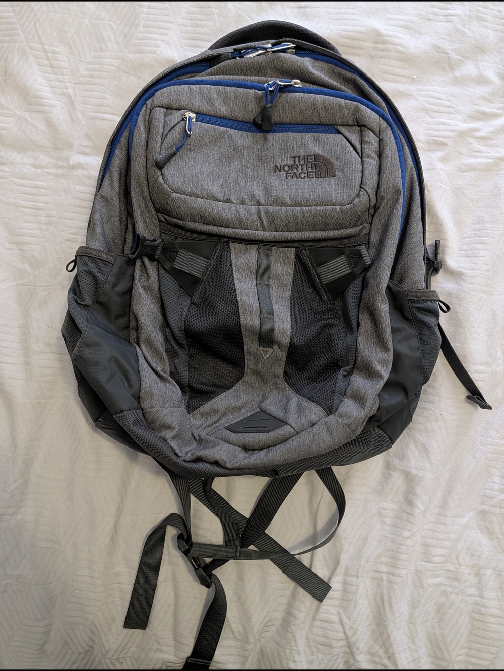 The North Face Men's Gray Backpack with Blue Accents
